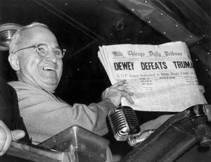 Nov. 4, 1948, file photo, President Harry S. Truman at St. Louis' Union Station holds up an election day edition of the Chicago Daily Tribune, which - based on early results - mistakenly announced "Dewey Defeats Truman." (AP Photo/Byron Rollins) Wiki Public Domain